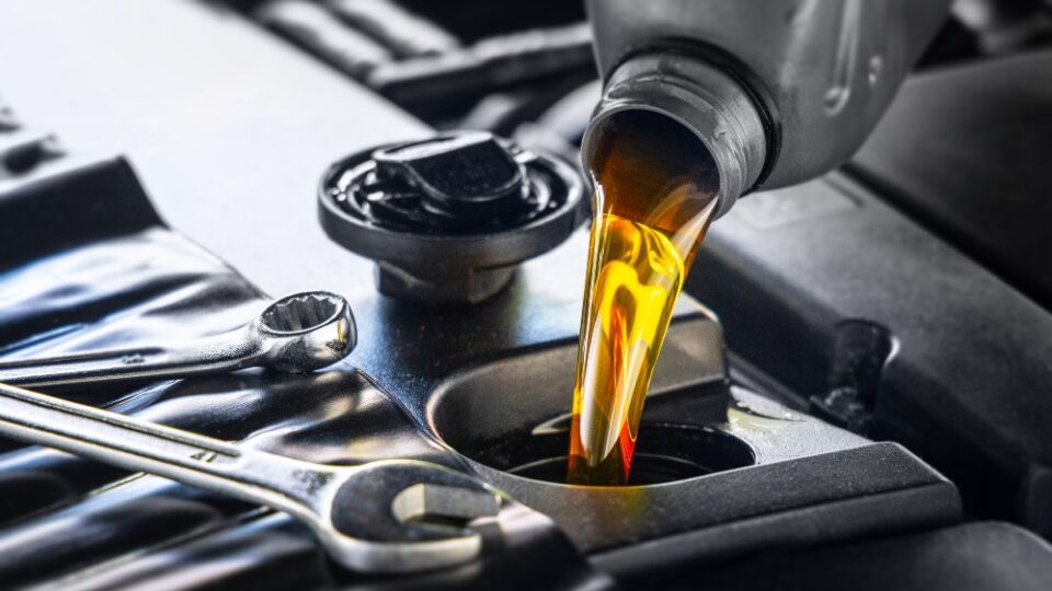 Oil filter and fresh motor oil prepared for service