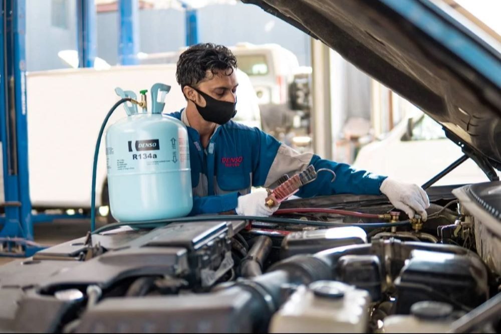 Technician checking AC system